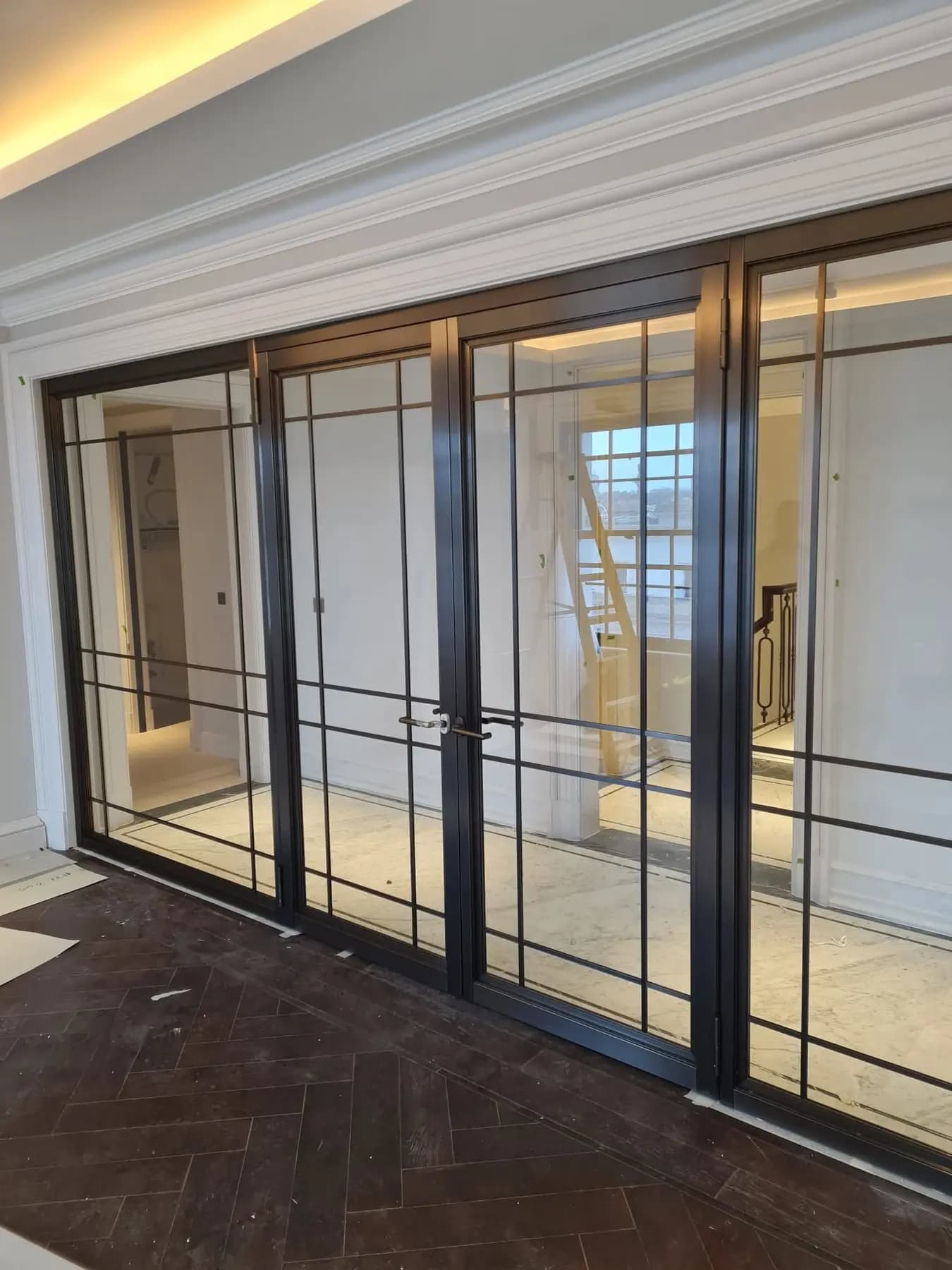 Tall black-framed glazed screen