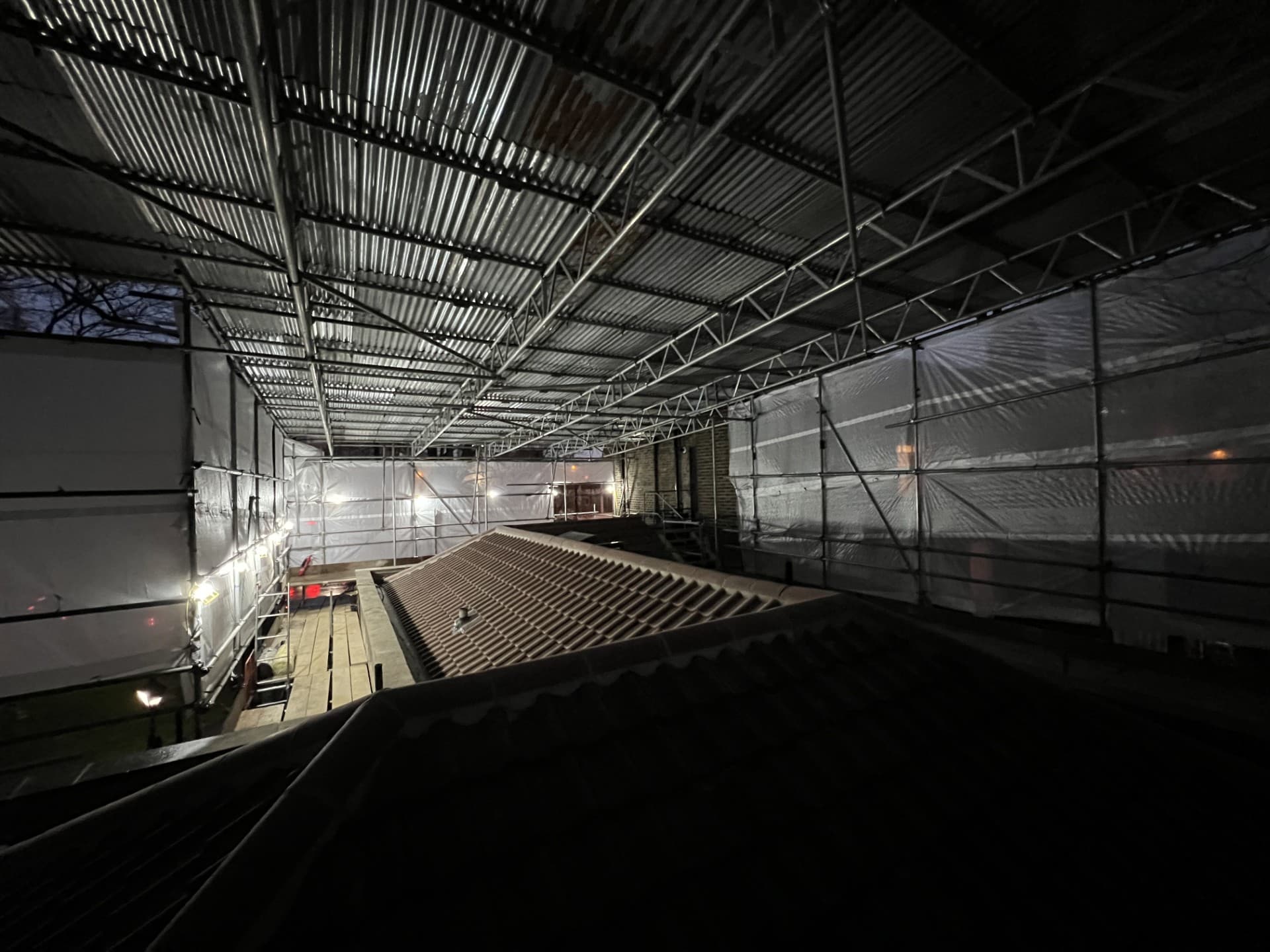 Covered scaffold protecting the Royal Foundation during roof refurbishment